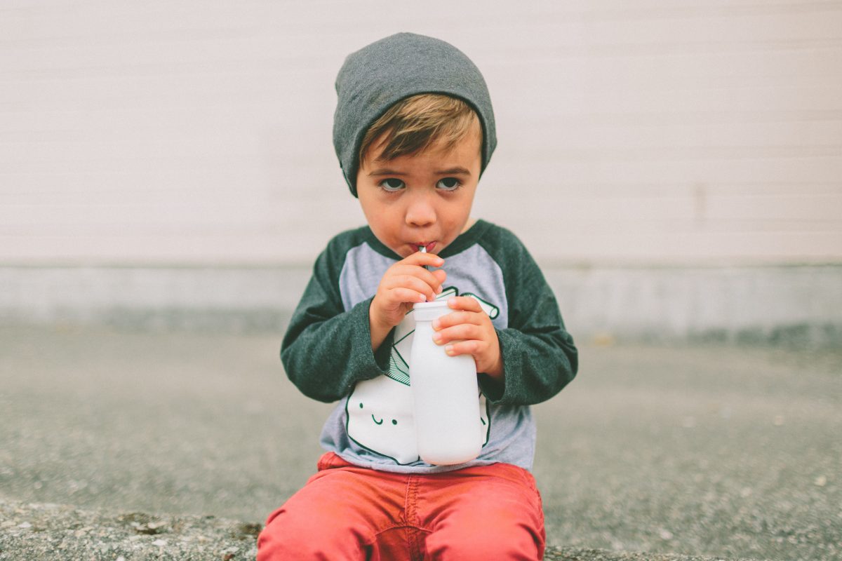 a-little-boy-drinking-milk-in-the-city-2021-08-30-10-25-31-utc-1200x800.jpg